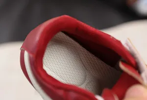 Breathable inner lining and comfortable mesh insole detail view of kids casual sneakers.