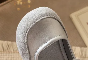 Close-up detail of grey kids princess leather shoes, soft suede and smooth splice design.