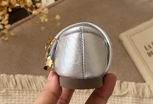 Silver metallic toddler girls dress shoes back detail view, soft sole flat footwear.