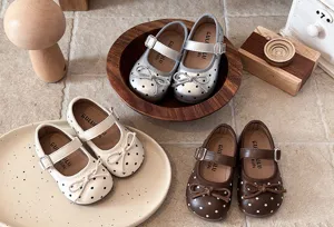 Detailed view of cute kids polka dot Mary Jane flat shoes, soft leather soft sole design.