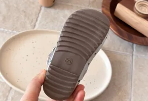 Detailed view of children's leather shoes sole, size 23 display, soft sole Mary Jane.