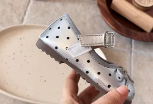Silver polka dot Mary Jane shoes for toddler girls with cute bow and hook-and-loop strap.