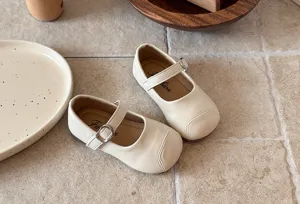 French style toddler girls flat shoes with soft sole, elegant strap and stitching.