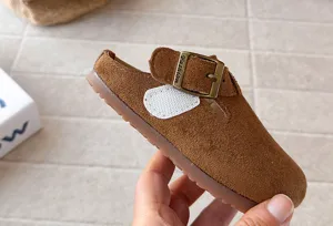 Kids retro suede clog slippers detail shot, soft sole slip-on closed toe half shoes summer.