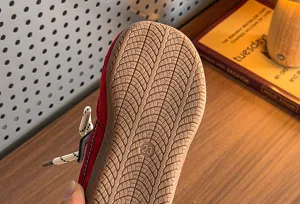 Detailed view of kids retro sneaker rubber sole with anti-slip pattern and size marking.