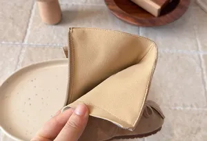 Kids mid-calf boot detail showing soft inner lining and neat stitching craftsmanship.