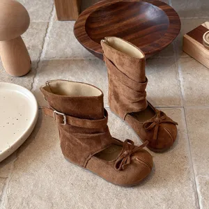 Girls brown suede mid-calf boots with cute bow and cutout design for spring and autumn wear.