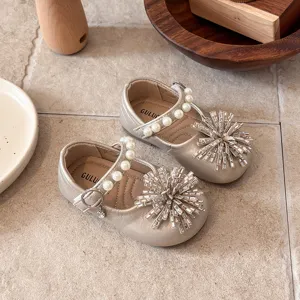 Chic metallic gold toddler girls Mary Jane flat shoes with pearl strap and crystal toe bow.