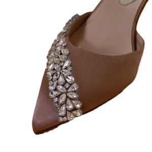 Nude satin pointed toe high heels with dazzling crystal rhinestone embellishments.