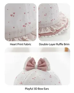Delizioso cappellino da pesca per neonata con stampa a cuori e fiocco tridimensionale.