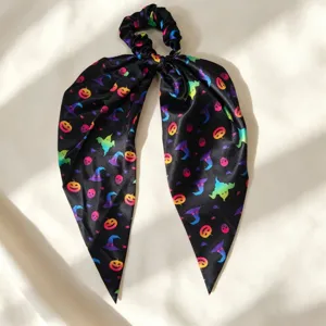 Halloween satin hair scrunchie with long ribbon, colorful pumpkin and ghost print for party.