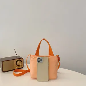 Mini sac cabas en nylon orange pour femmes, sac bandoulière mignon et sac à main.