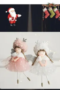 Vista di dettaglio di simpatici ciondoli a bambola angelo di Natale con corna e abito in tulle.