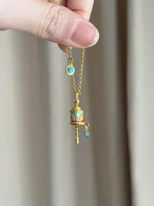 Tibetan style golden enamel prayer wheel necklace with turquoise pendant for women retro chic.