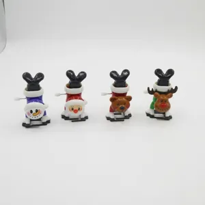 Vier Stile von Weihnachten Handstand Aufziehspielzeug inklusive Schneemann und Weihnachtsmann.