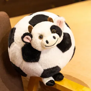 Cute cow football plush pillow toy, creative round stuffed animal doll for kids gift.