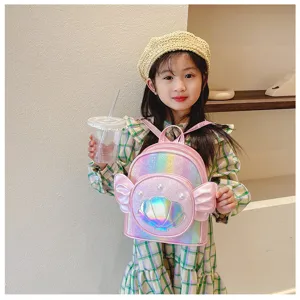 Kids glitter shell backpack detail, cute pink holographic school bag for little girls.