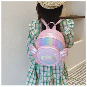 Pink glitter kids backpack with shell and wings detail, stylish girls school bag for daily use.