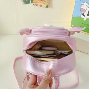 Pink cute kids backpack for girls, adorable animal ears and pearls design for school daily use.