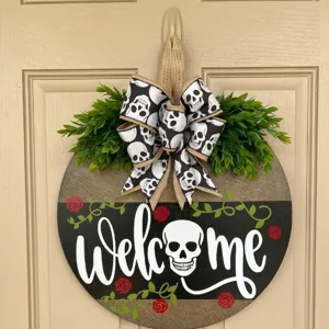 Halloween round wooden door sign with skull bow and greenery for holiday decoration.
