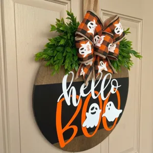 Halloween wooden door sign with cute ghost and buffalo plaid bow, festive hanging decor for home wall.