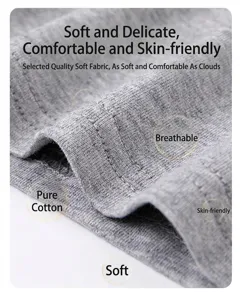 Close-up detail of soft breathable pure cotton gray fabric showing fine knit texture and quality.