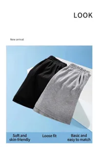 Children cotton casual shorts detail view, soft fabric and loose fit five point pants.