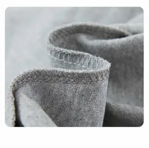 Children's pure cotton casual shorts fabric close-up, showing fine stitching and soft texture.