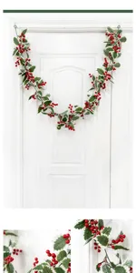 Artificial Christmas garland with red berries and holly leaves, perfect for holiday home wall decor.