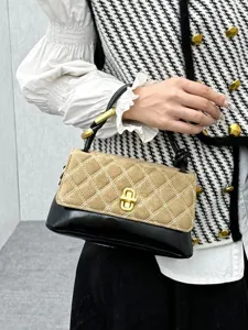 Women stylish quilted baguette bag, two-tone suede and leather handbag with chic gold clasp.
