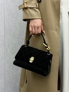 Stylish black quilted women baguette bag with top handle and chic gold turn lock for daily use.