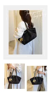 Detail view of the vintage suede tote bag with palm charm, stylish and versatile for daily use.