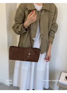 Minimalist brown suede shoulder bag for women, large capacity underarm tote for daily commute.