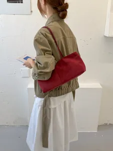 Minimalist red suede shoulder bag, large capacity fashion underarm tote for commuting daily.