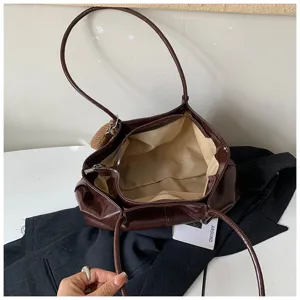 Brown PU leather retro slouchy shoulder bag interior detail, large capacity tote design.