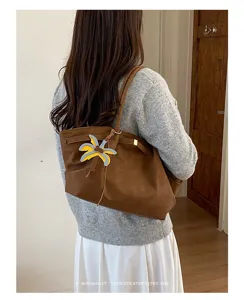 Women brown retro shoulder tote bag casual minimalist large capacity commuter bag with pendant.