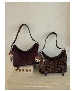 Minimalist retro suede shoulder bag with chic leopard print and cute plush bear charm.
