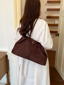 Brown soft slouchy shoulder tote bag for women, retro casual commuter underarm handbag style.