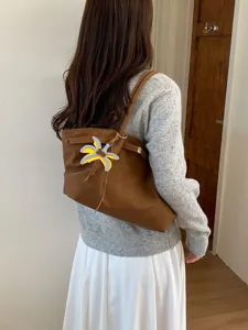 Chic retro brown tote bag for women, large capacity shoulder bag with cute leather charm.
