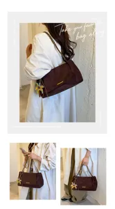 Chic brown suede underarm shoulder bag for women with chain strap and flower charm.