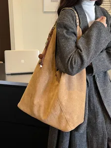 Vintage suede shoulder dumpling bag, large capacity casual commuter handbag for women.