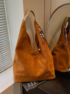 Vintage brown suede shoulder bag large capacity hobo dumpling bag with chic beaded strap.