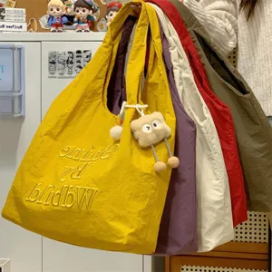 Casual canvas tote bag with letter embroidery, large capacity multi-color shoulder bag.