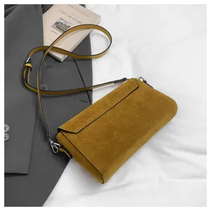 Mustard yellow suede shoulder bag detail, stylish casual crossbody small square handbag.