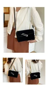 Black suede crossbody bag with metal lock clasp, stylish casual shoulder bag for women.
