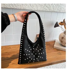 Black studded shoulder bag for women, stylish faux leather hobo handbag with silver rivets.