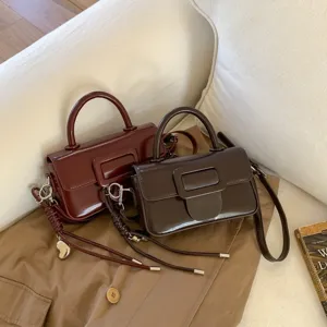 Retro glossy patent leather crossbody bag with square buckle, stylish small shoulder bag.