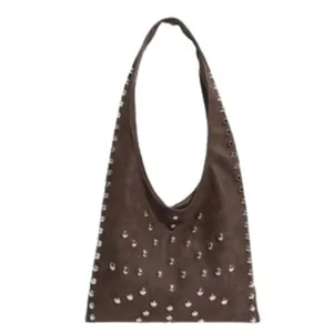 Brown suede hobo shoulder bag with metal studs, trendy vintage commuter armpit handbag for women.