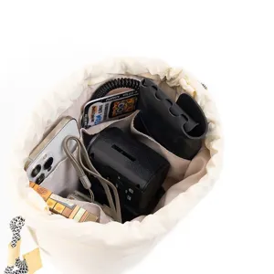 Detailed view of quilted mirrorless camera bag interior with organizer compartments.