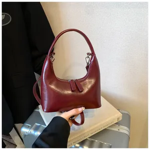 Vintage burgundy crescent shoulder bag for women, stylish PU leather hobo handbag with zip.